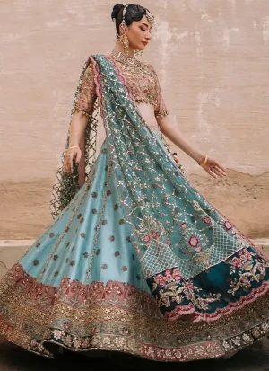 Aqua mehndi lehenga choli back view with multicoloured tassel ties and a sheer teal floral lattice dupatta