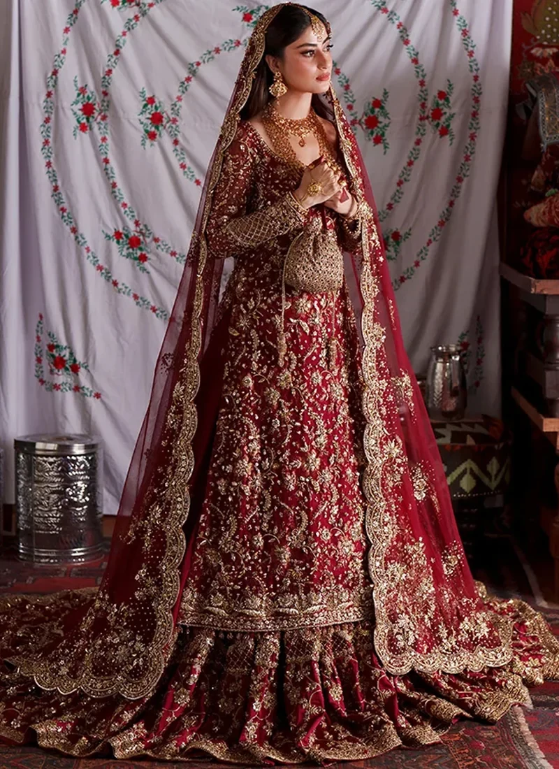 Deep Red Baraat Farshi Lehenga with Scalloped Zardozi Dupatta Border Deep red farshi lehenga side view with gold floral embroidery and scalloped net dupatta border
