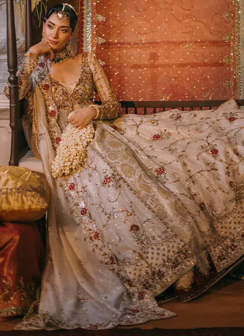 Ivory Reception Open Gown with Lehenga with Contrast Resham Rose Dupatta Ivory open gown with lehenga, seated front view showing gold rose vines, embroidered hem and sheer ivory dupatta