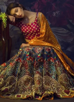 Fuchsia mehndi choli front close-up with scattered gold floral motifs and an embroidered round neckline