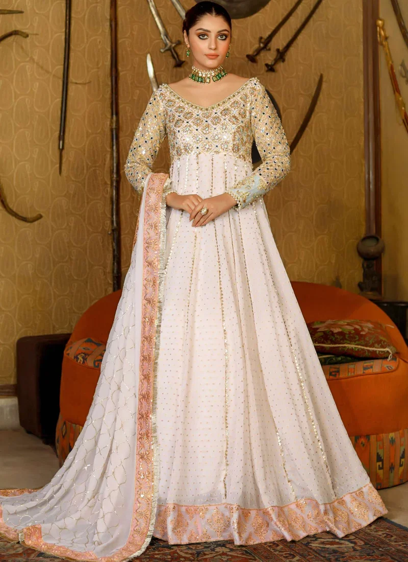 Off White Nikkah Gown with Pearl-Fringed Scoop Back Off white bridal pishwas back close-up showing a deep scoop neckline with cascading pearl tassels